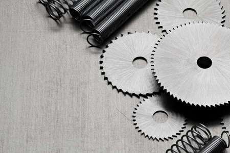 Several discs for the circular saw and metal springs on the tableの写真素材