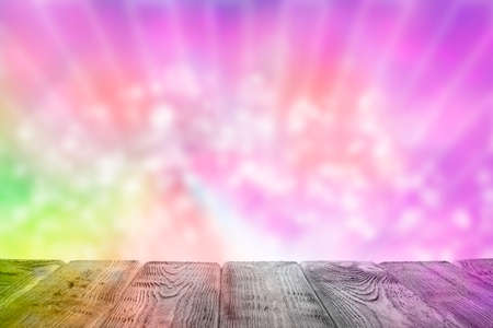 Empty wooden table on colorful abstract backgroundの写真素材