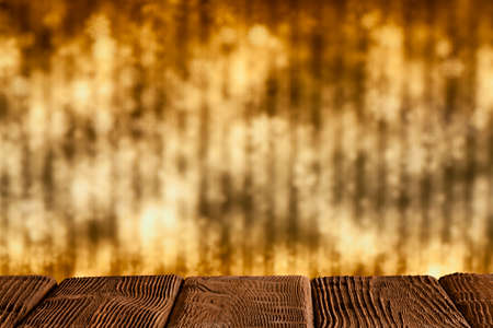 Wooden table with free space on abstract backgroundの写真素材