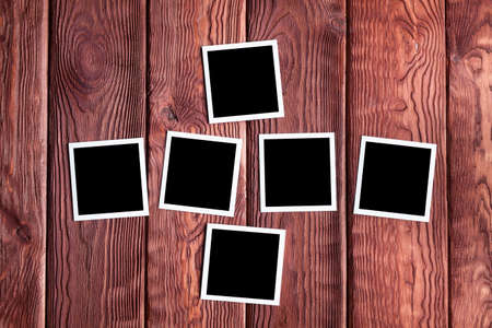 Classic photo frames on wooden boardの写真素材