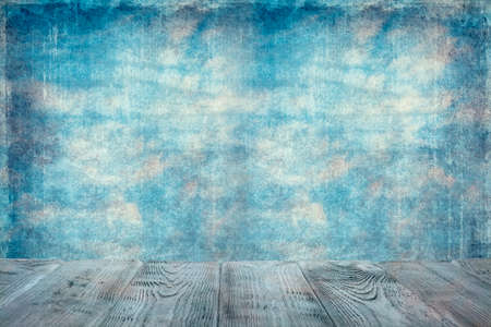 Wooden table with empty space on grunge wall backgroundの写真素材