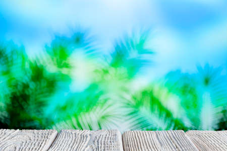 Table with empty space on abstract nature backgroundの写真素材