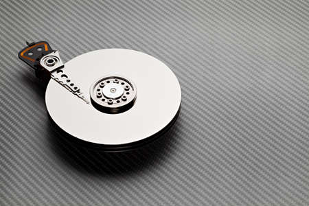 Hard disk drive on carbon fiber backgroundの写真素材