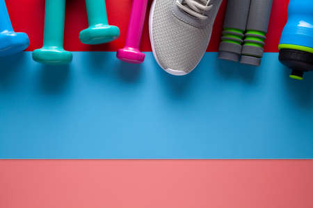 Sports and fitness equipment on colored backgroundの写真素材