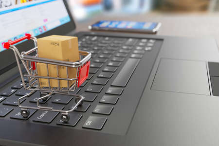 E-commerce symbol - shopping cart, two cardboard shipping boxes, laptop and smartphone - symbols of online shopping and delivery - 3d illustrationの写真素材
