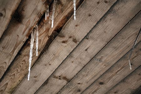 Icicles on Wooden Roofの写真素材