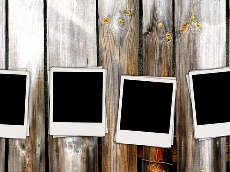 Blank Photos on Wooden Wallの写真素材