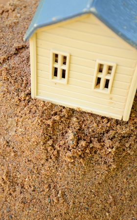 Toy House on Sandの写真素材