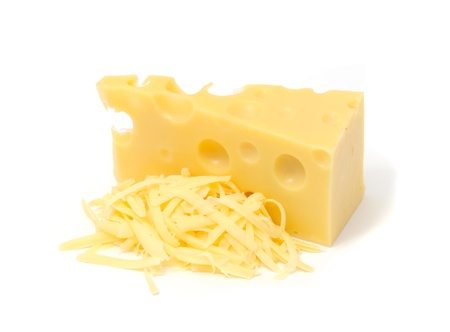Chunk of Swiss Cheese And Pile of Grated Cheese Isolated on White Backgroundの写真素材