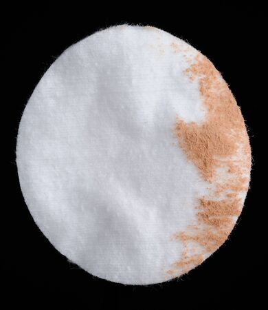 Cotton Pad with Facial Powder on Black Backgroundの写真素材