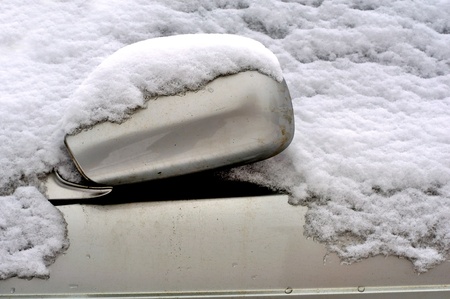 Car Covered in Snow in Winterの写真素材