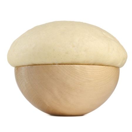 Rising Yeast Dough in Wooden Bowl Isolated on White Backgroundの写真素材