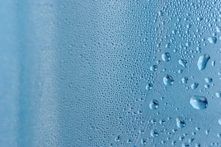 Close-Up of Water Drops on Blue Backgroundの写真素材