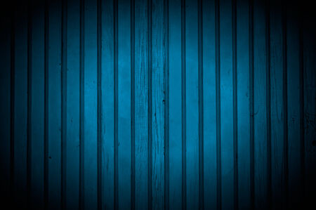 Spotlight on Dark Blue Wooden Wallの写真素材