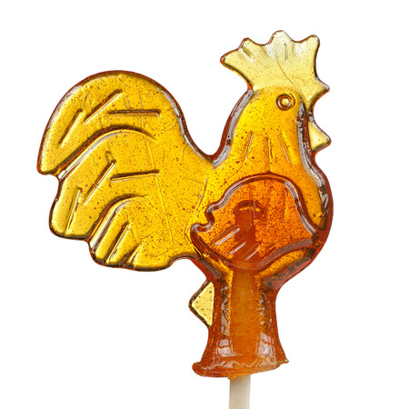 Sugar Lollipop in the Shape of Rooster Isolated on Whiteの写真素材