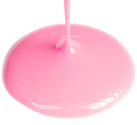 Pouring strawberry drinking yogurt on white backgroundの写真素材