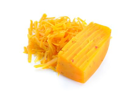 Chunk of Cheese and Pile of Grated Cheese Isolated on Whiteの写真素材