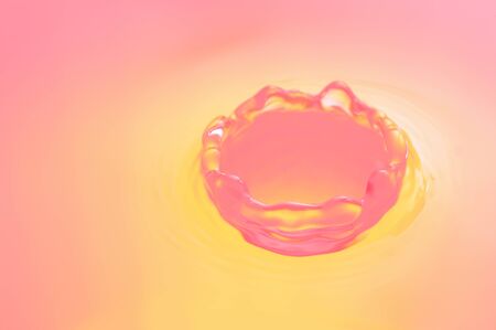 Macro of pink and yellow water splash