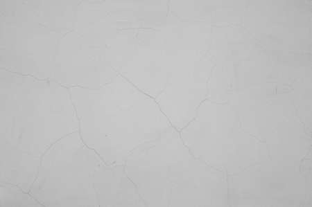 Grey cracked stucco background texture