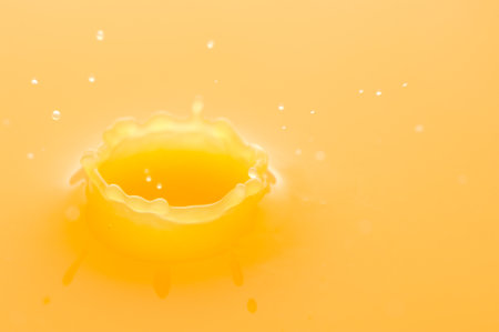 Macro of orange juice splashの写真素材