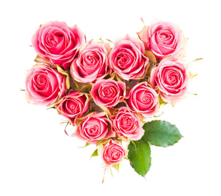 Heart symbol made of fresh pink-red Rose flowers isolated on white background. Love concept for Valentines and Mothers Day.の写真素材