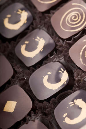 Mixed luxury dark and milk chocolate truffles. Assorted delicious handmade chocolate pralines in a...