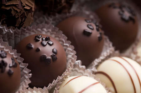 Mixed luxury dark and milk chocolate truffles. Assorted delicious handmade chocolate pralines in a...