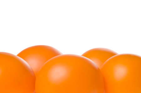 Bunch of fresh ripe orange tomatoes isolated on white background. Studio shot.の写真素材