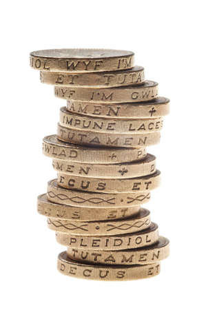 UK Pound coin currency stack on white background. British money coins isolated on white.の写真素材
