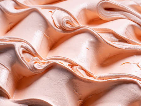 Frozen Peach flavour gelato - full frame detail. Close up of an orange- beige surface texture of Ice cream .の写真素材