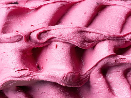 Frozen Pomegranate flavour gelato - full frame detail. Close up of a pink surface texture of Ice cream.の写真素材