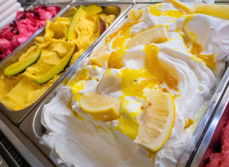 Various Gelato in a store window. Multicolor Ice cream rack in a snack bar close-up.の写真素材