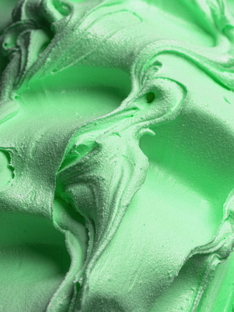Frozen creamy Mint flavour gelato - full frame detail. Close up of a green surface texture of Ice cream.の写真素材