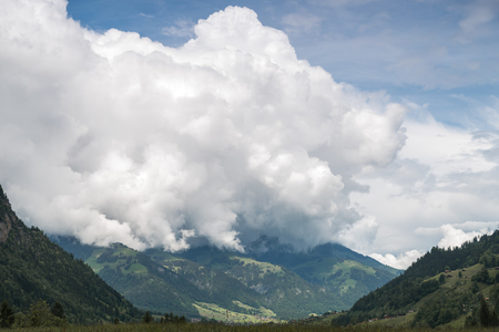 Clouds over swiss Alpsの写真素材