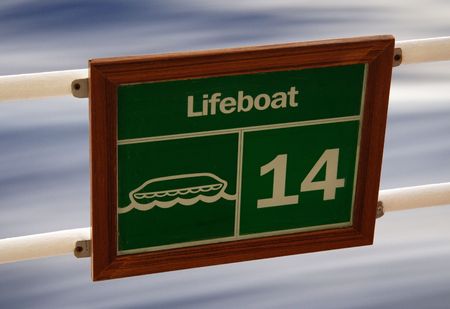 Sign on a cruise ship with 'flowing' water backgroundの写真素材