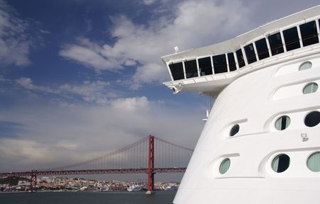 Front of a cruiseship and large rope bridge in the backgroundの写真素材