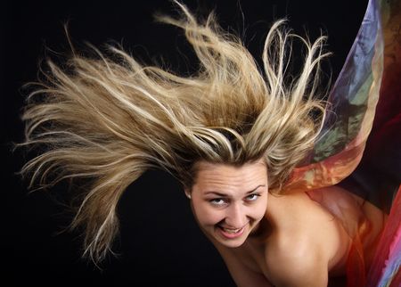 Erotic blond woman with blowing hairs and foulardsの写真素材