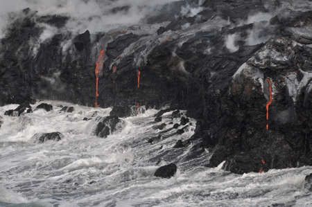 Lava flow meeting coast, Kilauea, Big Island of Hawaiiの写真素材