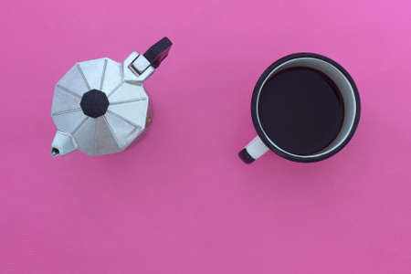 top view of espresso pot and coffee cup on pink backgroundの写真素材