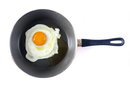 fried egg isolated on a white backgroundの写真素材