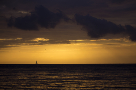 Silhouette of a yacht sailing against sunset. seascape.の写真素材