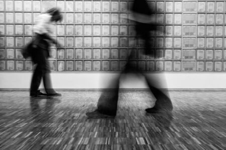 people moving in black and whiteの写真素材