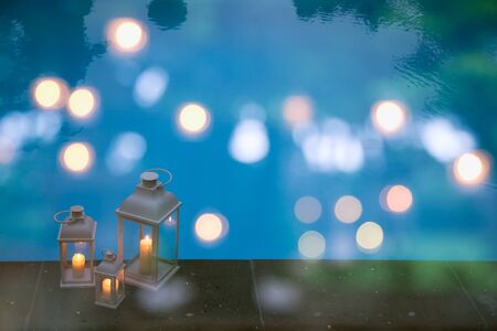 Traditional white lanterns in a garden with poolの写真素材