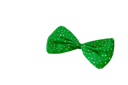 A bright green bow tie with sequins isolated on white.                               の写真素材