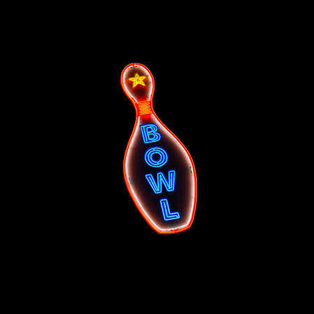 A glowing neon sign featuring a bowling pin with the word の写真素材