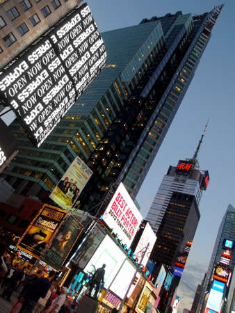 A scene in New York City Times Square, on September 17, 2014, photographed in a vertical dutch tilt frame with lights and sky scrapers at dusk.のeditorial素材