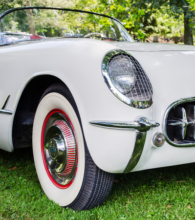 Classic American Car with grill, headlight and wheel.のeditorial素材