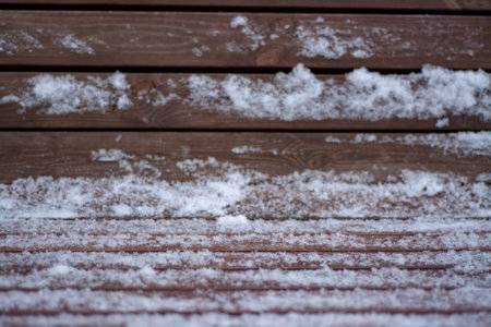 Winter wooden texture of wooden planks under the snowの写真素材