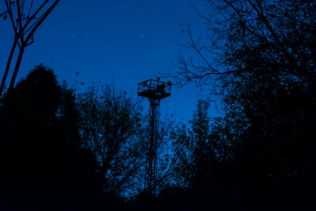 Observation tower of the railway on the background of the night, starry skyの写真素材