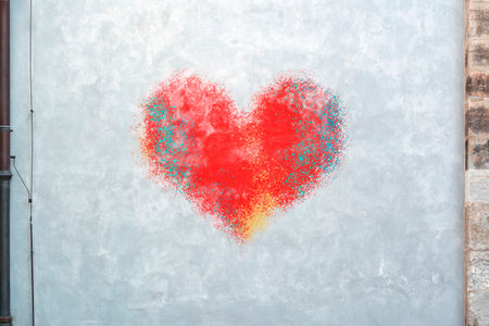 Concrete wall with a painted red heartの写真素材